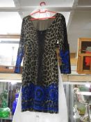 A leopard print designer dress (no makers labels)