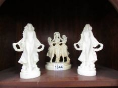 Three resin figures including The Three Graces and two others.
