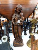 A antique carved wood figure of the Madonna and child. 56cm.