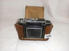 A cased Zeiss Ikon camera