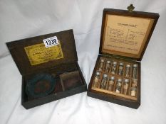A cased London screw set with vials of miniature screws plus pan scales