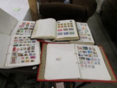 A collection of world stamps in five albums.