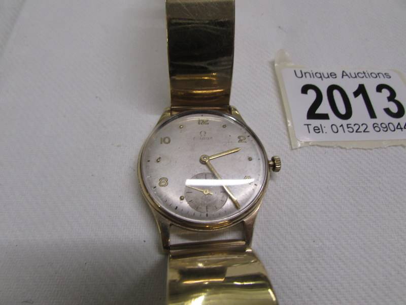 A 9ct gold Omega wrist watch on a 9ct gold strap, in working order. - Image 2 of 11