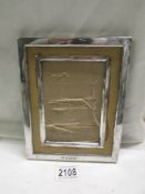 A hall marked silver photo frame, 20 x 16.5 cm.