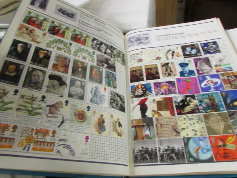A collection of UK stamps in five albums/folders. - Image 4 of 14