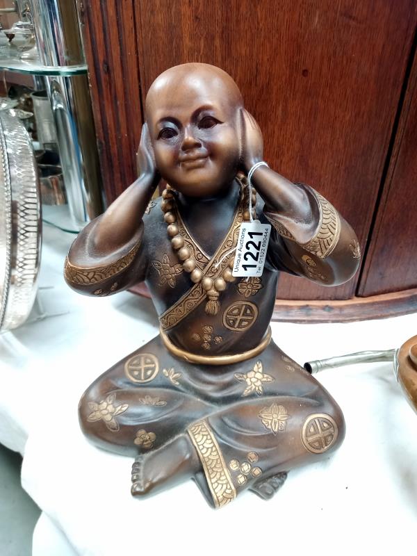 A resin Boy Buddha.