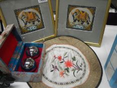 Two Chinese paintings on silk, a pair of stress balls and a Chinese embroidery.
