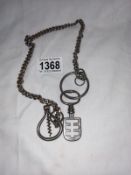 A Victorian metal chain with an antique metal key, & antique metal cast bottle opener