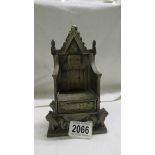 A brass silver jubilee throne.