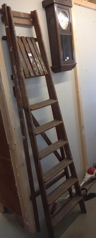 A tall wooden step ladder