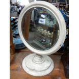 An old Victorian round painted shop mirror