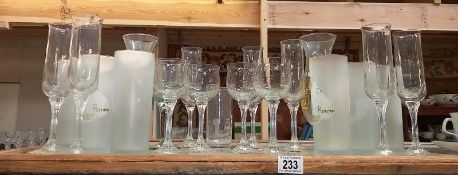 A collection of tall drinking glasses