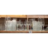 A collection of tall drinking glasses