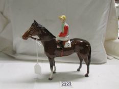 A Beswick horse with jockey, 1963-1984. In good condition.