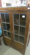 A lead glazed door cabinet. COLLECT ONLY.