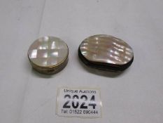 A miniature purse with mother of pearl and a mother of pearl pill box.