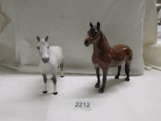 A Beswick Dartmoor pony and another Beswick pony, in good condition.