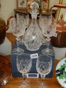 A set of six Bohemian crystal glasses and a decanter.