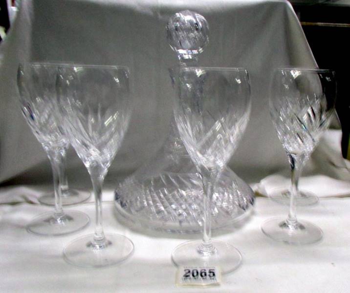 A cut glass ship's decanter and 6 wine glasses.