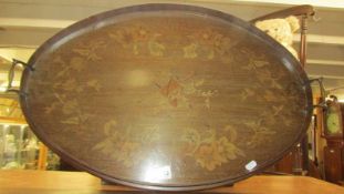 An oval mahogany inlaid tray.