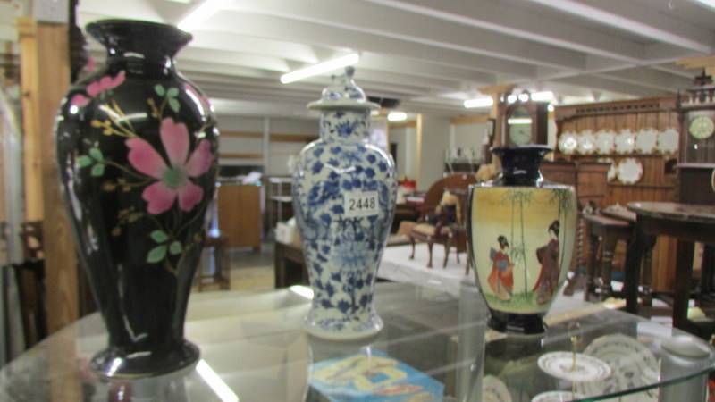 A Chinese blue and white lidded vase a/f, a Japanese vase and another vase.