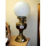 An old brass oil lamp in working order