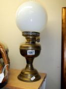 An old brass oil lamp in working order