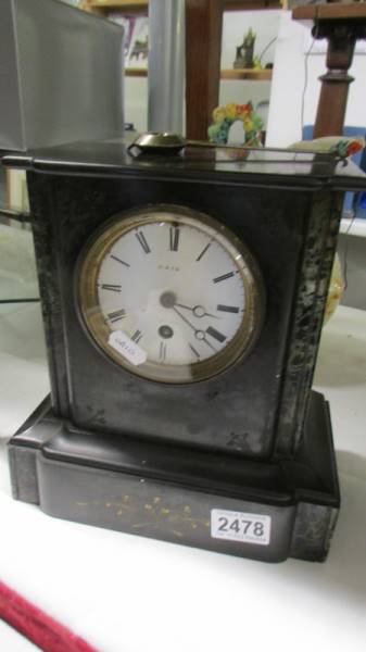 A black slate mantel clock, spring ok, no key. COLLECT ONLY.