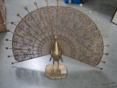 A cast metal Peacock fire screen