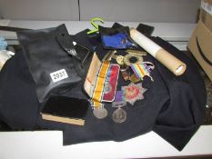 A collection of militaria and medals including Cheshire regiment with other medals and ephemera.