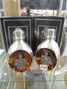 A pair of boxed Dimple Royal Decanters with contents.