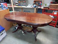 An oval mahogany twin pedestal dining table, COLLECT ONLY.