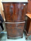 A dark wood drinks cabinet. ( 62cm x 44cm x height 130cm) COLLECT ONLY