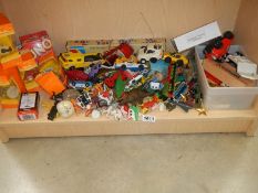 A shelf of vintage plastic and other toys.