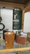 A bottle of Glenfiddich 12 year old malt whisky, 3 hip flasks and set of 4 cased tumblers.