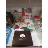 A mixed lot of napkins, handkerchiefs, Xmas gift wrap, table mats etc.
