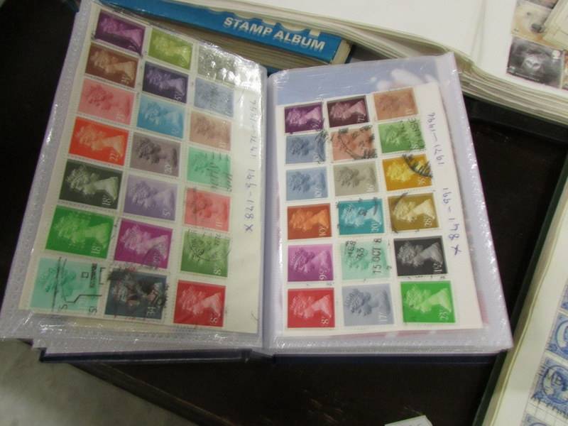 A collection of UK stamps in five albums/folders. - Image 13 of 14