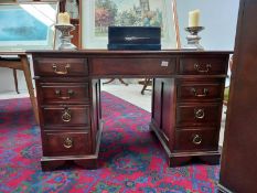 A kneehole desk with carver wood cutter panels (122cm x 68cm x 75cm approximately) COLLECT ONLY