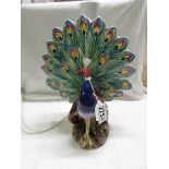 A peacock table lamp. Collect Only.