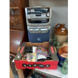 A compact disc karaoke system with 2 microphones, instructions, wires & some karaoke CD's (system