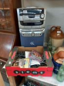 A compact disc karaoke system with 2 microphones, instructions, wires & some karaoke CD's (system