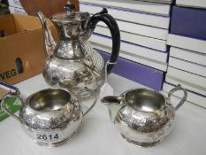 A three piece silver plate tea set.