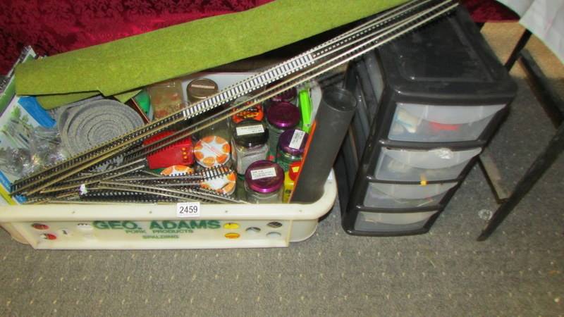 A good lot of '00' gauge model railway layout accessories, jars and contents etc.,