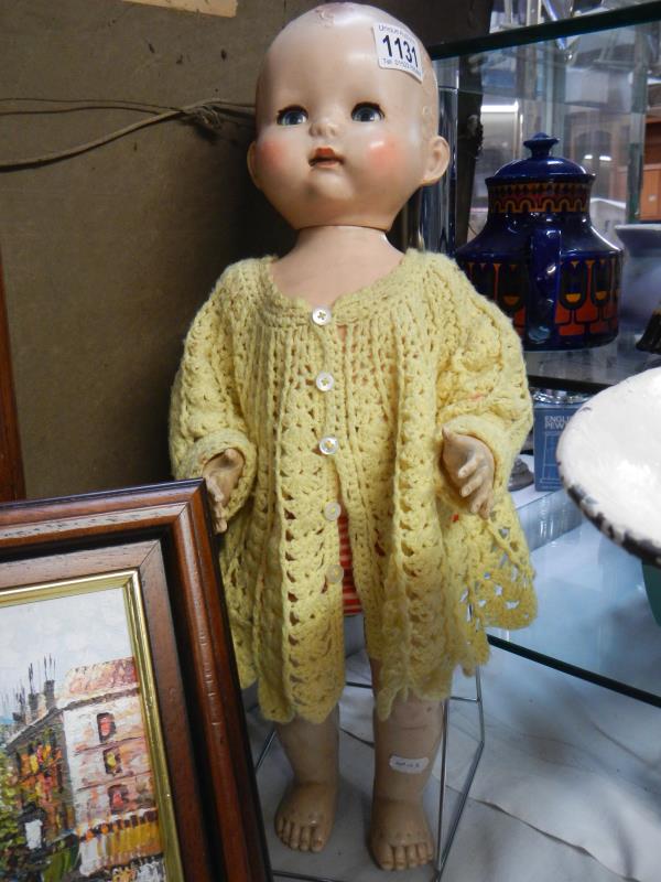 A mid 20th century doll with moving arms & legs