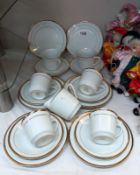 A gilt edged white china tea set with milk jug (setting for 6)