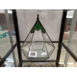 A triangular leaded stained glass plant holder/terrarium