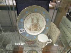 A Royal Doulton Prince Andrew and Sarah Ferguson wedding plate and a Wedgwood mug.