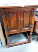 A linen fold 2 door oak cabinet in good order. Collect Only.