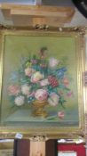 A gilt framed oil on canvas floral display.