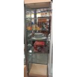 A glass display cabinet with wood top and bottom ( on wheels, 31 cm x 47cm x height 186 cm)